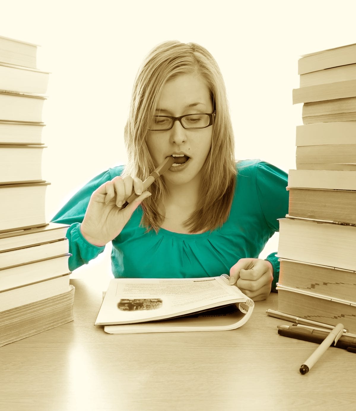 a woman with a mountain of books