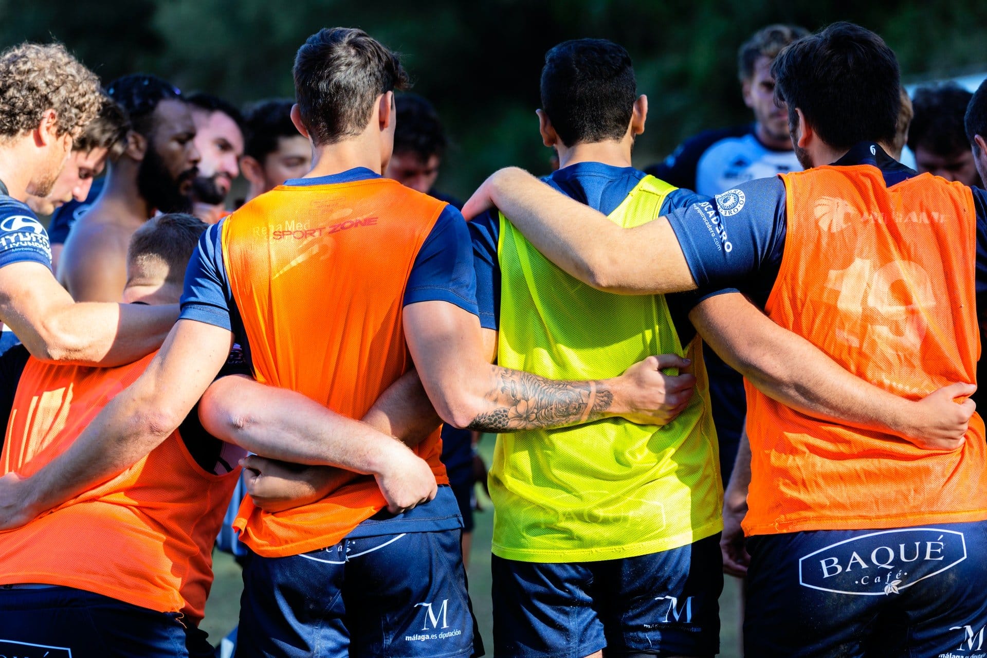 a football team huddle to represent becoming a member of the club as a key step to making partner