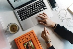 a person clicking onto a linkedin publisher post on their laptop