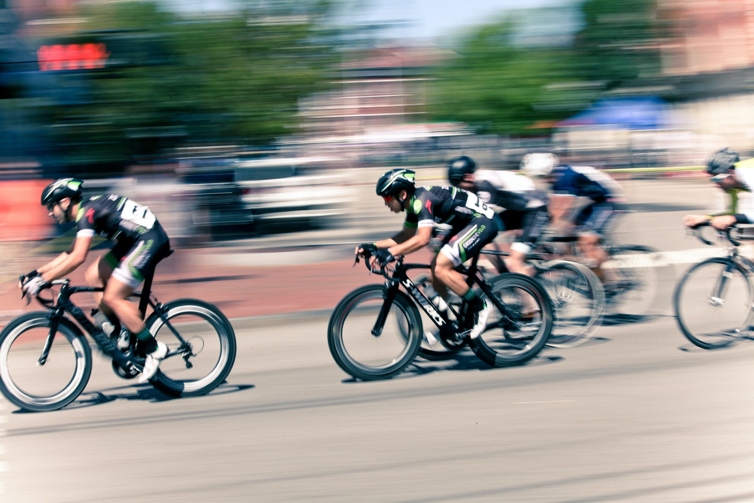 a blurred image of cyclists racing to represent a productive first day back to work