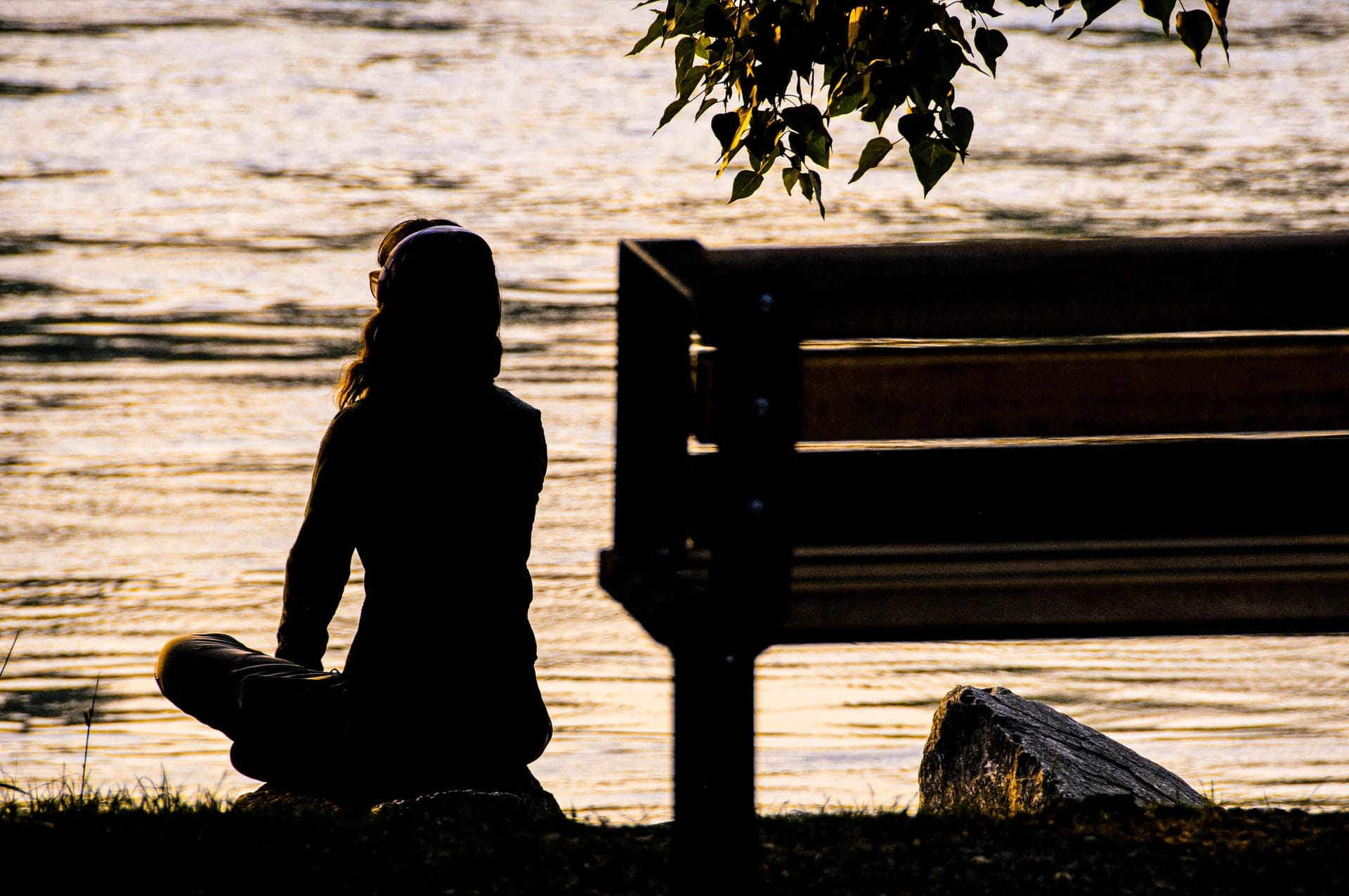 a woman sitting and meditating outside