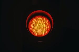 an amber traffic light to represent having to address issues to prepare your virtual team for the long haul