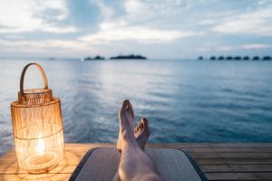 a man relaxing next to the sea to represent reflecting on the partnership admissions vote