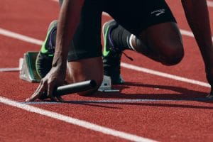 a runner at the starting block to represent preparing for partnership