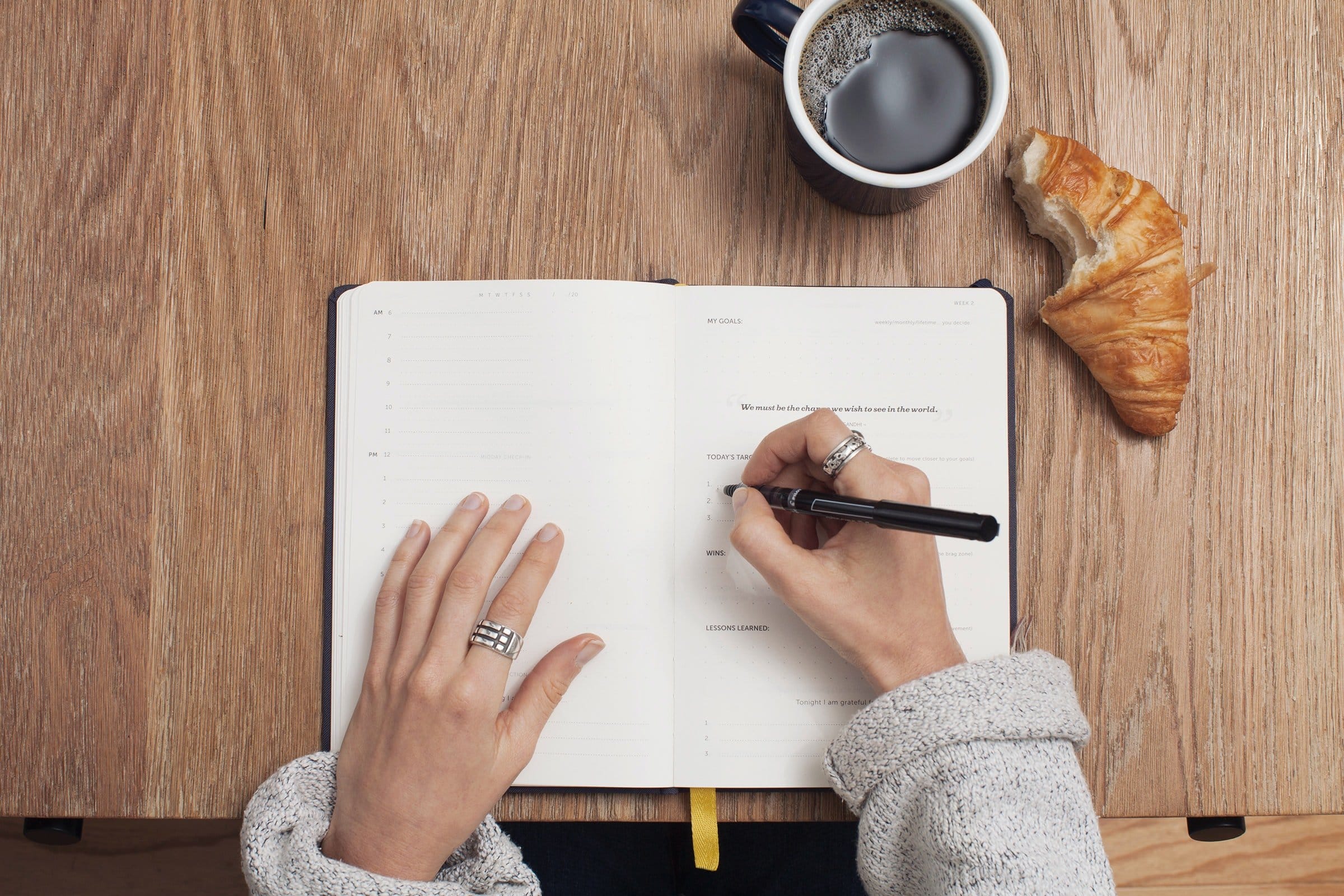 a woman writing a to do list of what to do after making partner