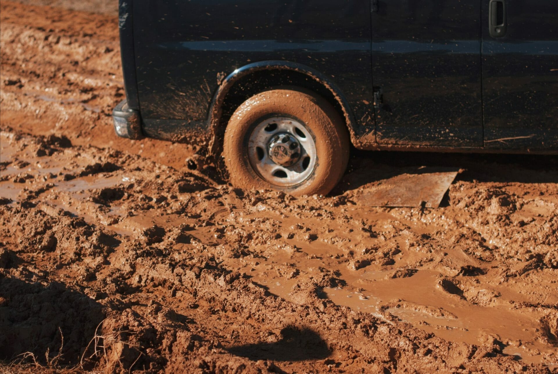 a tire stuck in the mud to represent being at a career crossroads