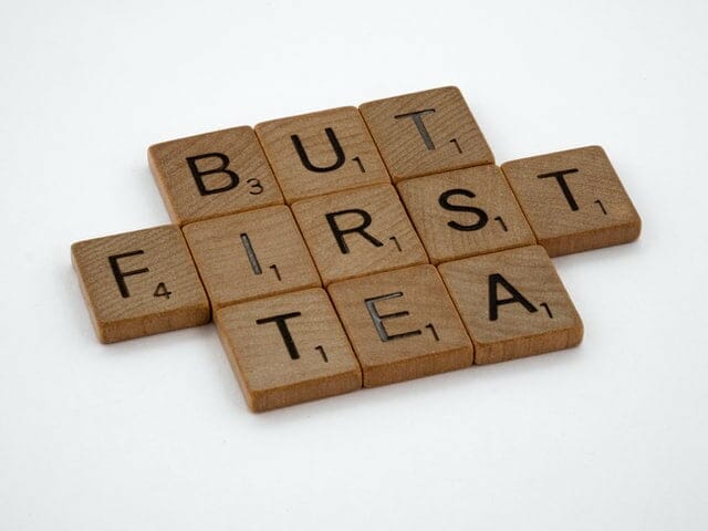 scrabble tiles spelling out But Tea First to represent what to prioritise after making partner