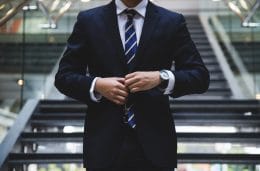 a man in a suit to represent acting like a partner