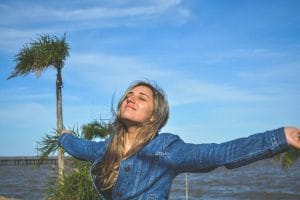 a woman looking relieved to represent the benefits of moving from industry to practice